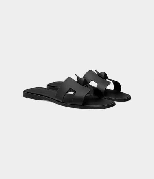 Hermès Oran Sandals for Women In Black Top Grain Cow Leather