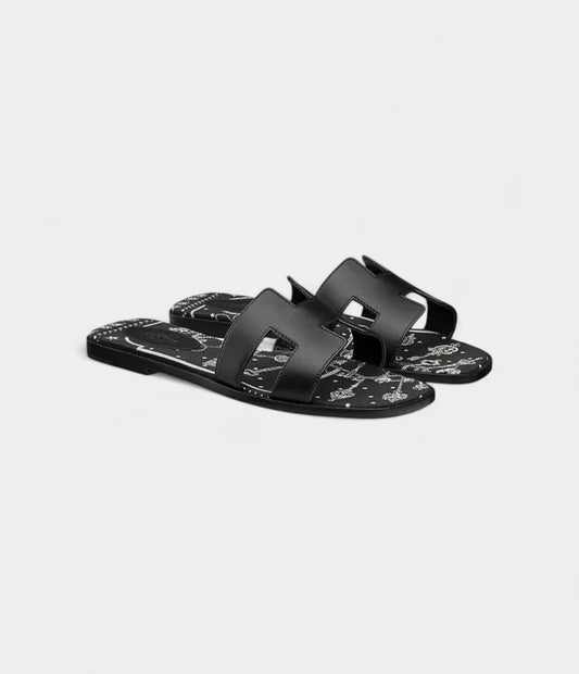 Hermès Oran Sandals for Women In Graffiti Black & Cow Leather