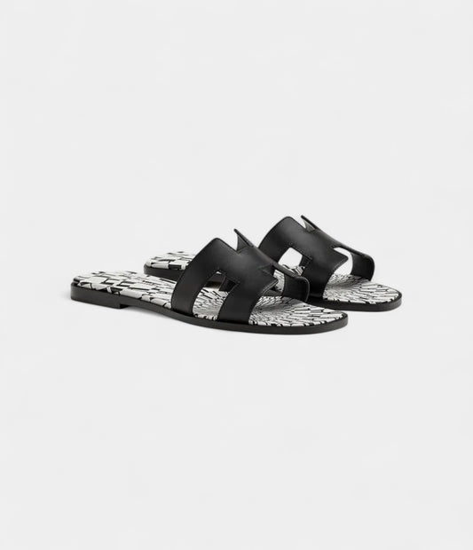 Hermès Oran Stylish Sandals for Women in Black & White Calfskin
