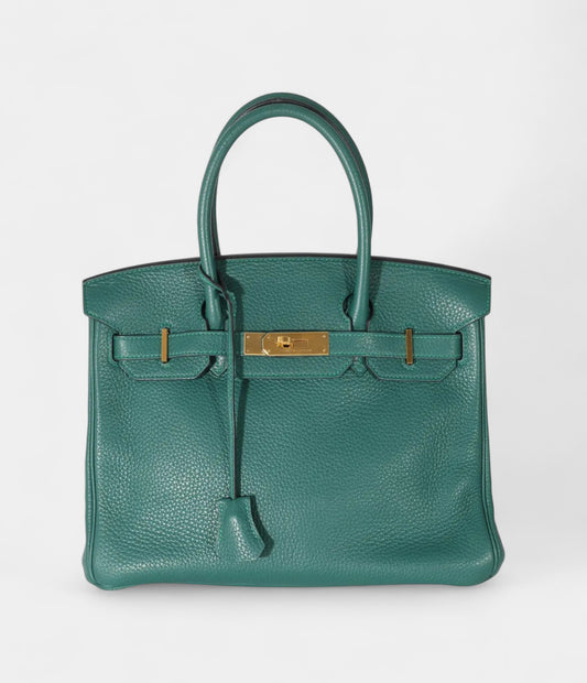The Hermès Birkin 30 Green Leather Handbag is a timeless symbol of luxury